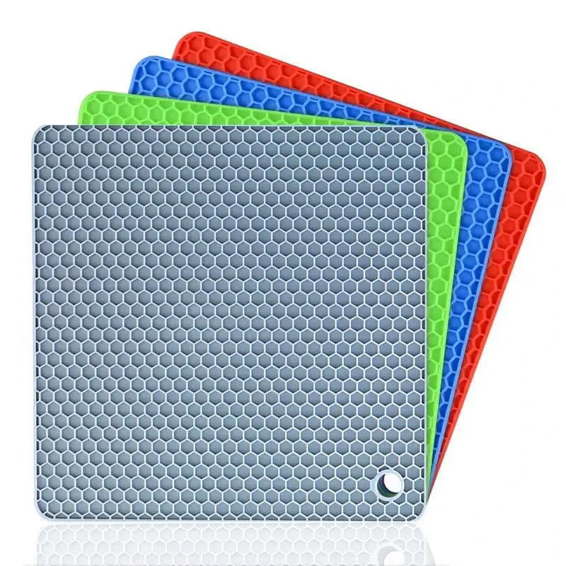 Set of four silicone mats with honeycomb pattern in blue, green, red, and gray on a white background.