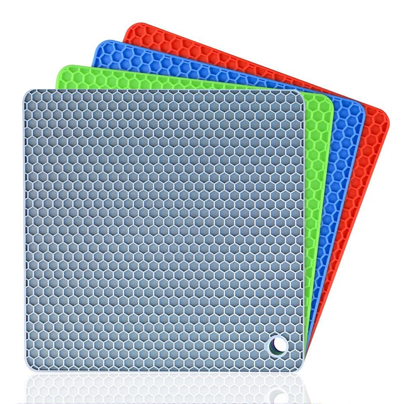 Set of four silicone mats with honeycomb pattern in blue, green, red, and gray on a white background.