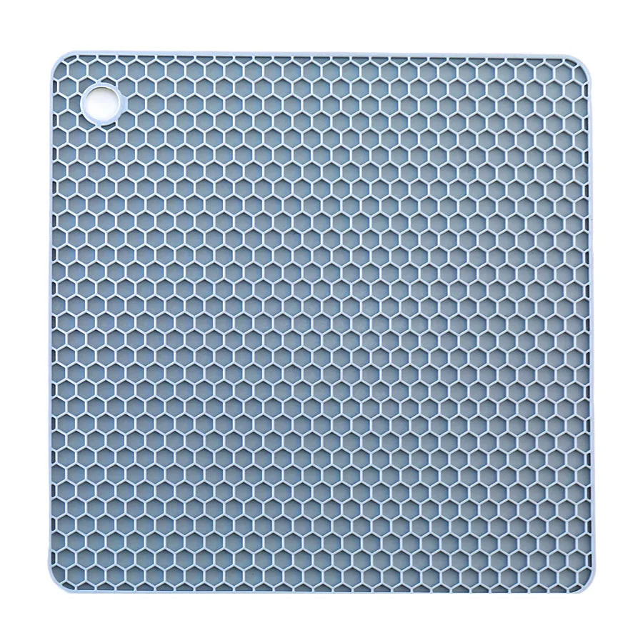 Blue honeycomb patterned mat on a white background