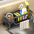 Kitchen sink caddy with cleaning supplies and a towel on a tiled wall background