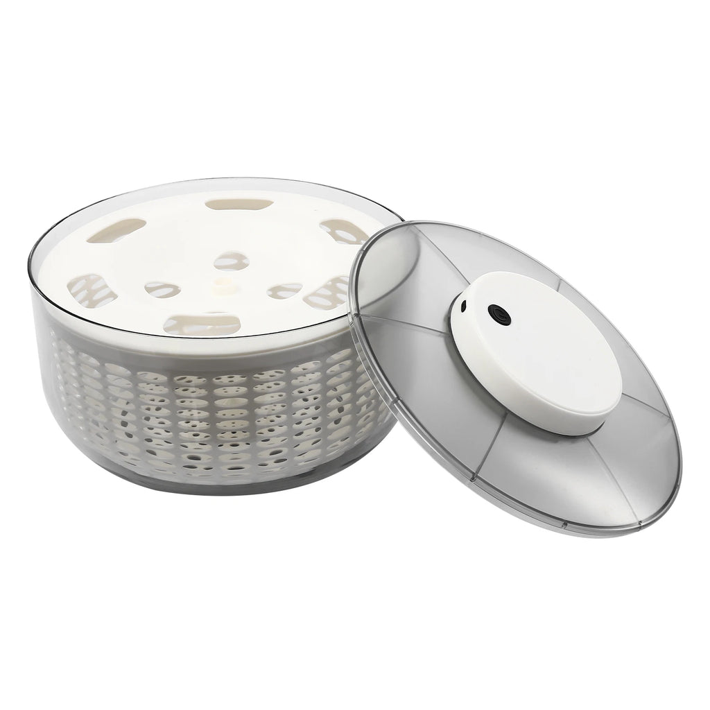 A white and clear plastic salad spinner basket with its matching lid leaning against it, shown on a plain white background.