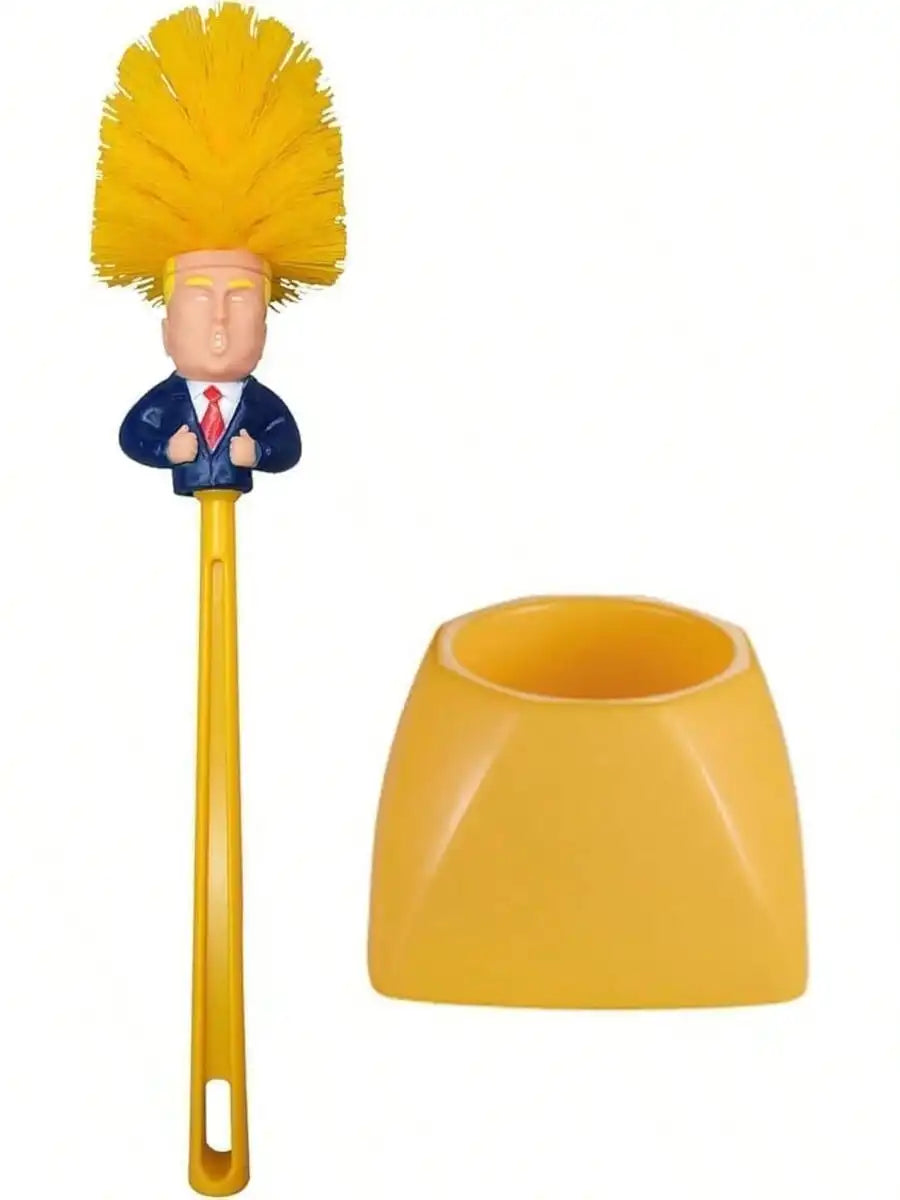 A novelty toilet brush with a yellow bristle head shaped like a small figure in a blue suit with a red tie, attached to a yellow handle, shown next to its matching yellow cap on a white background.