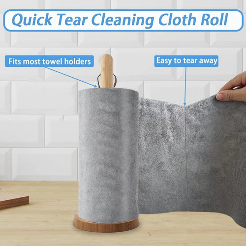 Roll of quick tear cleaning cloth with wooden holder on a tiled wall background