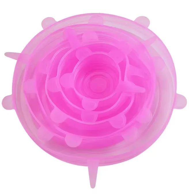 Pink silicone lid with suction cups on a white background