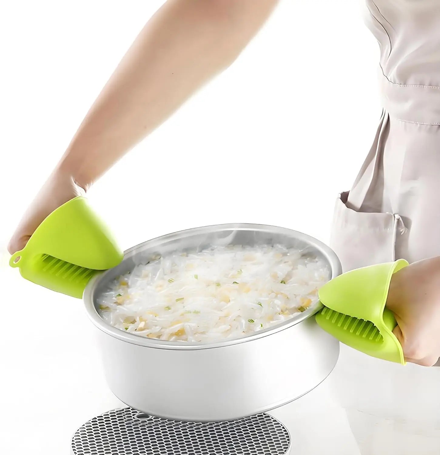 Person holding a colander with rice using green silicone handles.