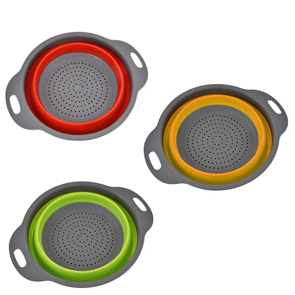 Three collapsible colanders with red, yellow, and green interior colors on a white background.