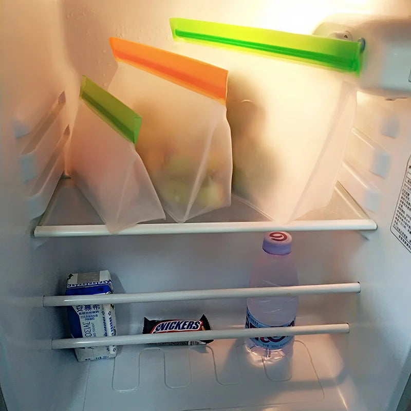 Open refrigerator with snacks and drinks on a shelf