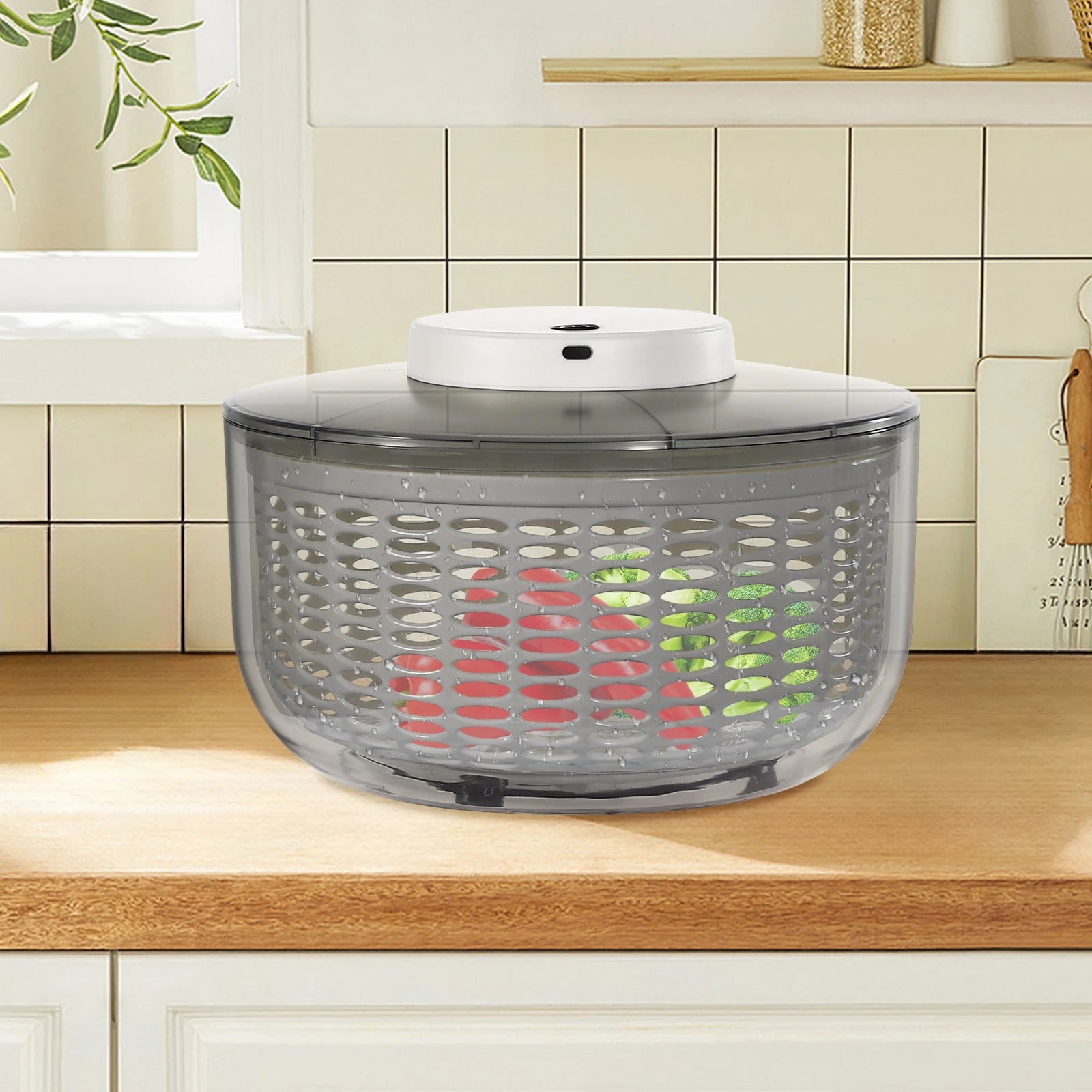 Salad spinner on a kitchen counter with a tiled wall in the background