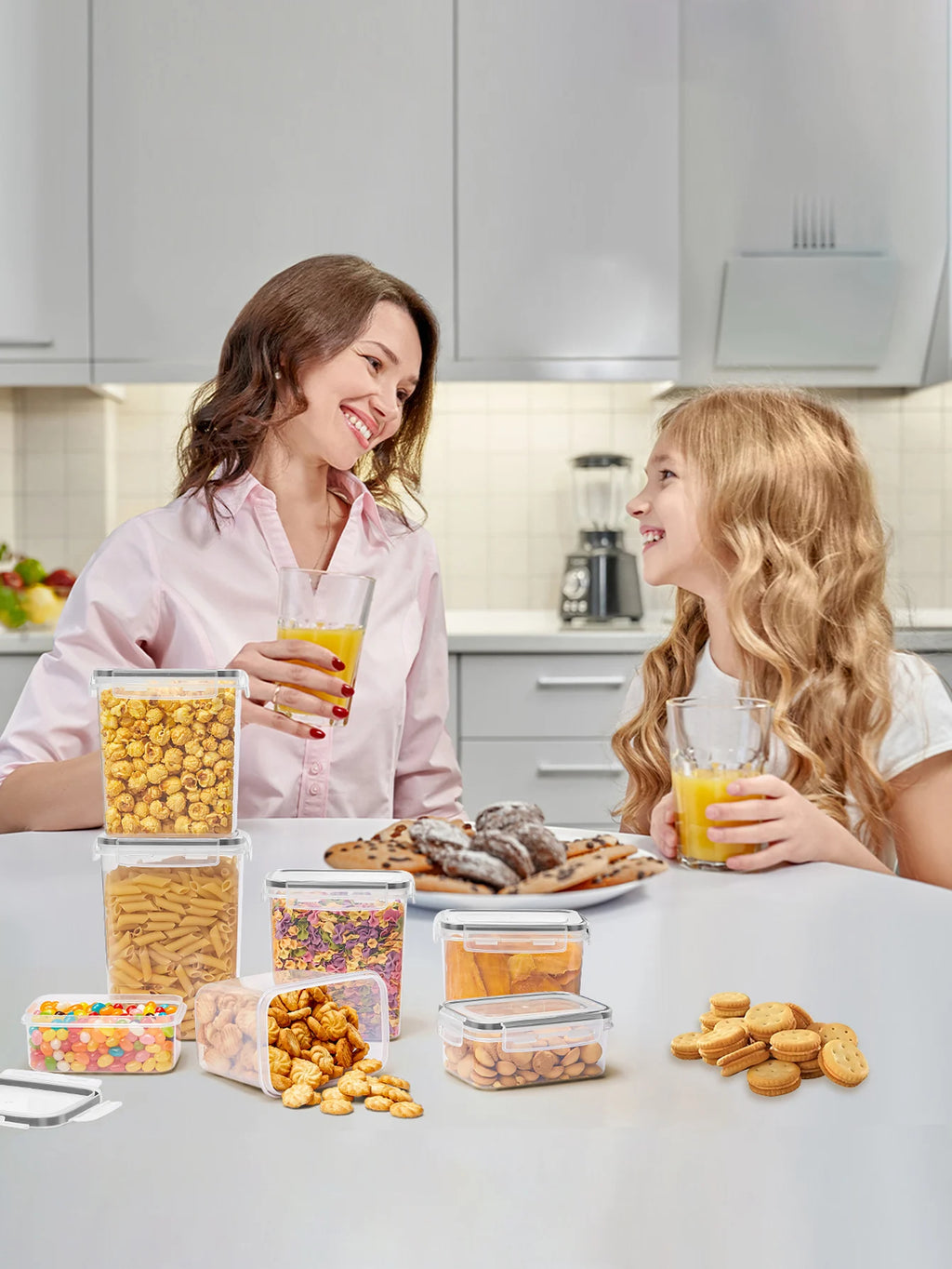Woman and child in a kitchen with snacks and drinks on a counter