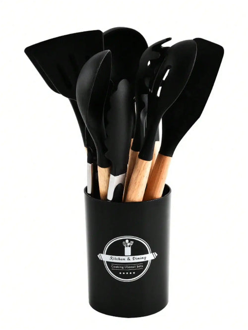 Set of black kitchen utensils in a black holder with a logo on a white background