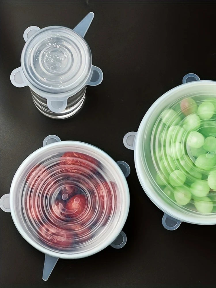 Three silicone lid containers with different contents on a black background