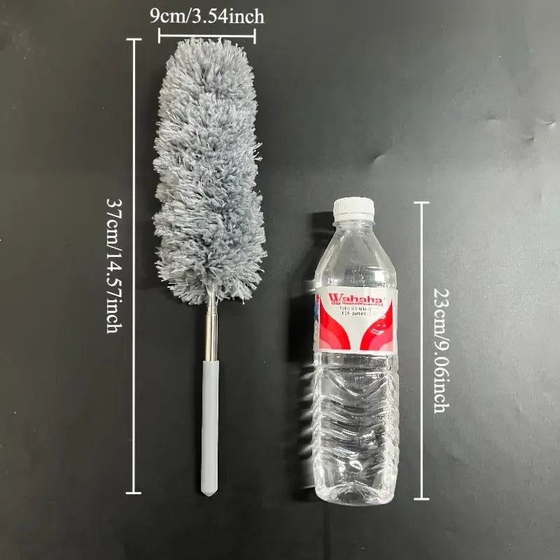 Cleaning brush next to a water bottle with measurements on a black background