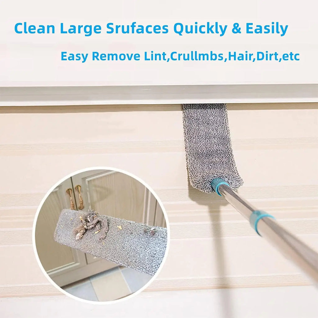 Cleaning tool with a telescopic handle and bristle head cleaning a surface.