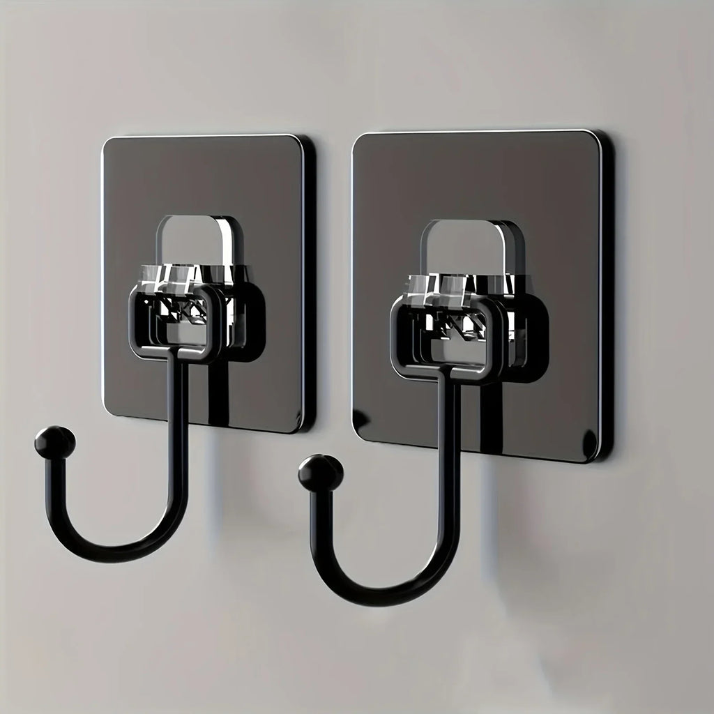 Two black wall hooks with metallic brackets on a light gray background