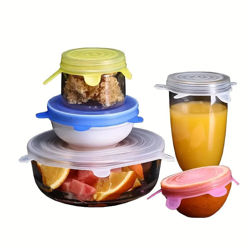 Set of silicone food covers in various colors on a white background