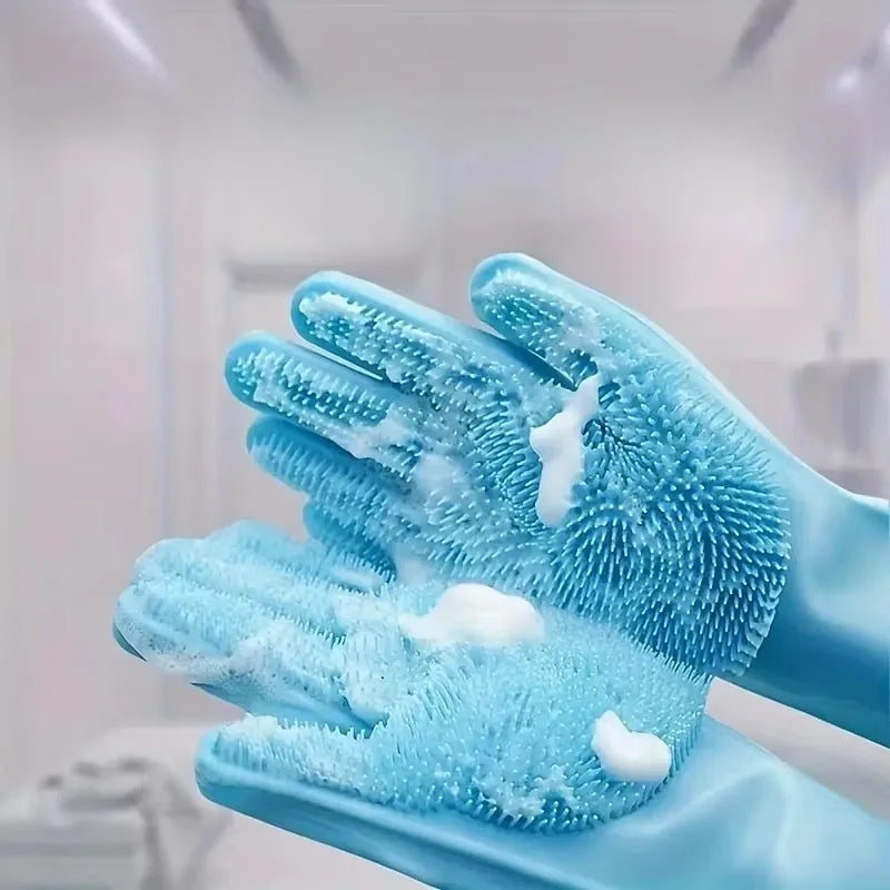 Blue cleaning gloves with textured surface and soap bubbles on a blurred background