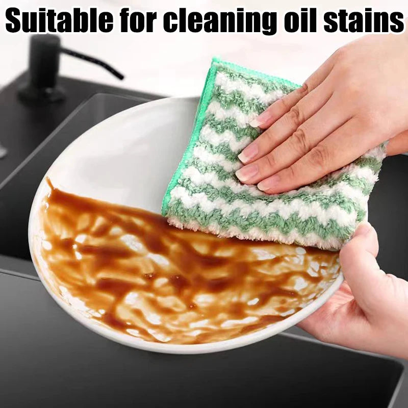 Hand using a green sponge to clean an oil-stained dish with text 'Suitable for cleaning oil stains'.