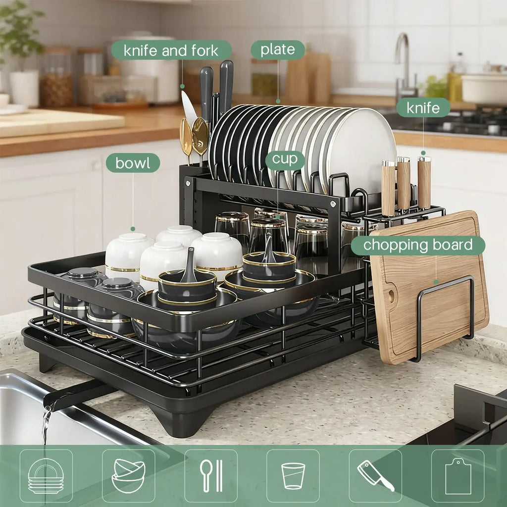 Kitchen dish rack with cutlery, plates, cups, and a chopping board on a kitchen counter.