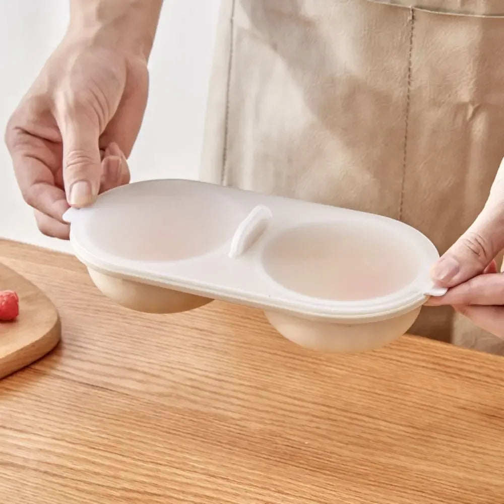 Person holding a white silicone lid over a bowl on a wooden surface