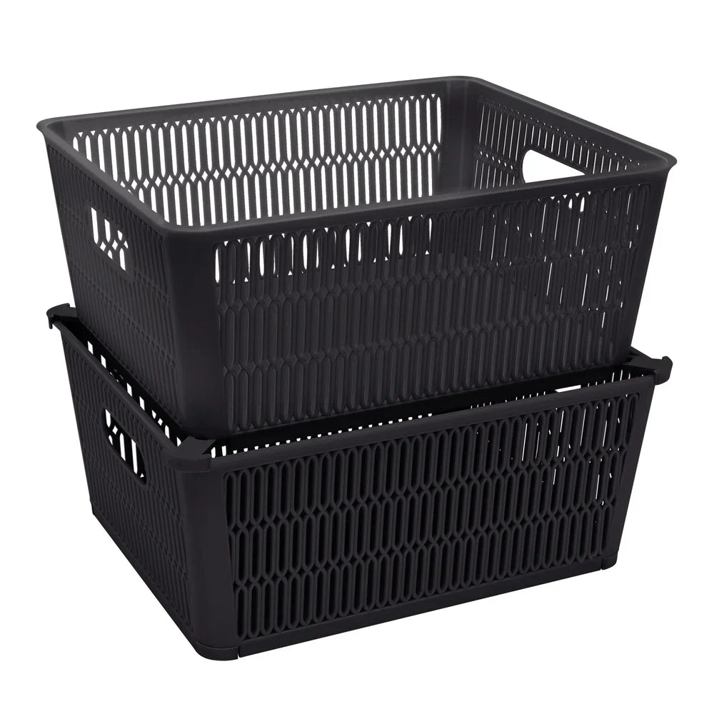 Two black storage baskets on a white background